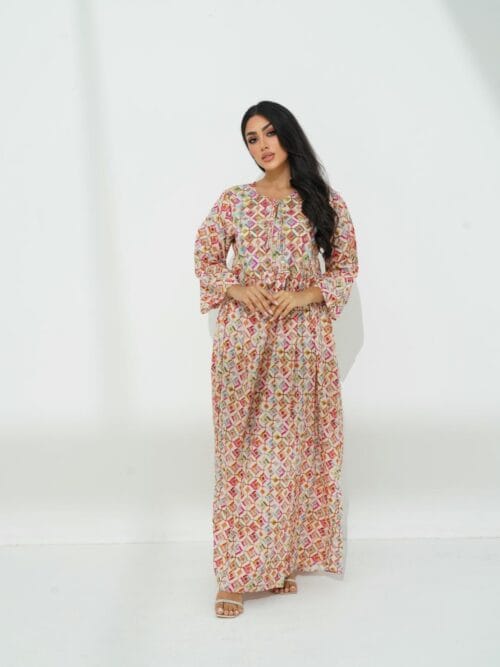 A graceful cotton dress with delicate beadwork